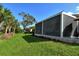 Screened patio with backyard view at 3924 Alamanda Dr, Sarasota, FL 34238