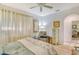Spacious bedroom with king bed, comfortable seating area and access to the bathroom at 3924 Alamanda Dr, Sarasota, FL 34238