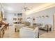 Open living room with ample seating and access to kitchen at 3924 Alamanda Dr, Sarasota, FL 34238