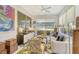 Relaxing sunroom with comfortable seating, large windows, and a view of the water at 3924 Alamanda Dr, Sarasota, FL 34238