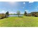 Large backyard with lush lawn and lake access at 14118 Florida Rosemary Dr, Bradenton, FL 34211