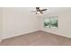 Spacious bedroom with ceiling fan and large window at 5240 11Th E St, Bradenton, FL 34203