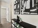 Modern entryway with black console table and stylish wall art at 1012 Myrtle Ave, Venice, FL 34285