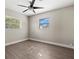 Bright bedroom with ceiling fan and large closet at 1012 Myrtle Ave, Venice, FL 34285