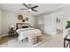 Spacious bedroom with queen bed and access to another room at 1012 Myrtle Ave, Venice, FL 34285