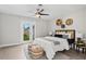 Spacious bedroom with a queen bed, and access to the backyard at 1012 Myrtle Ave, Venice, FL 34285