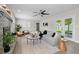 Living room with fireplace, French doors, and comfy seating at 1012 Myrtle Ave, Venice, FL 34285
