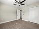 Spacious bedroom with ceiling fan, double door closet and access to bathroom at 1012 Myrtle Ave, Venice, FL 34285