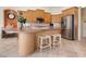 Modern kitchen with stainless steel appliances and an island at 9312 Firethorn Pl, Lakewood Ranch, FL 34202