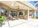 Covered patio with pool view and comfortable seating at 9312 Firethorn Pl, Lakewood Ranch, FL 34202