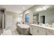 Elegant bathroom with soaking tub, double vanity, and walk-in shower at 12661 Oak Hill Way, Parrish, FL 34219