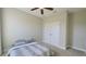 Cozy bedroom with double bed, ceiling fan, and double door closet at 12661 Oak Hill Way, Parrish, FL 34219