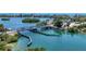 Stunning aerial shot of a waterfront community with a drawbridge, offering picturesque views at 14041 Bellagio Way # 214, Osprey, FL 34229