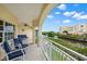 Spacious balcony with seating overlooking the canal at 14041 Bellagio Way # 214, Osprey, FL 34229