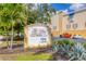 The Villas at Osprey Harbor Village, featuring a lush, tropical entrance and marina and dry rack storage at 14041 Bellagio Way # 214, Osprey, FL 34229