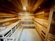 Wood paneled community sauna with benches offers a relaxing and luxurious wellness experience at 14041 Bellagio Way # 214, Osprey, FL 34229