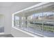 View from the apartment window, highlighting the property's canal views and lush landscaping at 14041 Bellagio Way # 214, Osprey, FL 34229