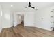 Bedroom featuring hardwood floors, a ceiling fan, and a doorway into another room at 2318 Bay St, Sarasota, FL 34237