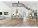 Bright open-concept space with a modern kitchen, dining area, and living room featuring wood flooring and high ceilings at 2318 Bay St, Sarasota, FL 34237