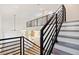 Staircase with metal handrails overlooking the main floor at 2318 Bay St, Sarasota, FL 34237
