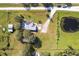 Aerial view showing house, detached barn, pond, and large lot at 424 Logue Rd, Myakka City, FL 34251