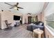 Spacious living room with hardwood floors and a comfortable sectional sofa at 424 Logue Rd, Myakka City, FL 34251