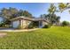 One-story home with attached garage and solar panels at 424 Logue Rd, Myakka City, FL 34251
