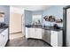 Clean and efficient kitchen with stainless steel dishwasher and sink at 424 Logue Rd, Myakka City, FL 34251