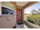Front door entrance with a screened-in porch at 424 Logue Rd, Myakka City, FL 34251