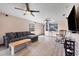 Bright living room featuring hardwood floors and ceiling fans at 424 Logue Rd, Myakka City, FL 34251