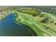 Aerial view of golf course with lake and lush landscaping at 5271 Mahogany Run Ave # 713, Sarasota, FL 34241