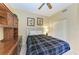 Guest bedroom with built-in desk and ceiling fan at 5271 Mahogany Run Ave # 713, Sarasota, FL 34241