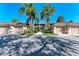 Front view of condo building, featuring attached garages and lush landscaping at 5271 Mahogany Run Ave # 713, Sarasota, FL 34241