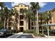 Exterior view of condo building with parking at 6515 Grand Estuary Trl # 305, Bradenton, FL 34212