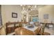 Formal dining room featuring hardwood floors and a large chandelier at 6918 73Rd E Ct, Bradenton, FL 34203