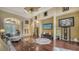 Bright living room featuring hardwood floors, high ceilings and views to the foyer at 6918 73Rd E Ct, Bradenton, FL 34203