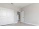 Simple bedroom with double doors and neutral wall colors at 2938 Woodward Ave, North Port, FL 34286