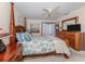 Spacious Primary bedroom with a king-size bed and ample closet space at 232 Woodland Dr, Osprey, FL 34229