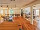 Bright community room featuring hardwood floors and ample seating at 232 Woodland Dr, Osprey, FL 34229
