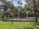playground nestled in a shady, wooded area at 232 Woodland Dr, Osprey, FL 34229