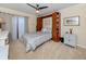 Guest bedroom with a built-in Murphy bed and access to a balcony at 232 Woodland Dr, Osprey, FL 34229