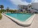 Community pool with plenty of lounge chairs at 232 Woodland Dr, Osprey, FL 34229