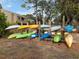 Community kayak storage with various colors available for residents at 232 Woodland Dr, Osprey, FL 34229