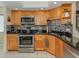 Modern kitchen with stainless steel appliances and granite countertops at 232 Woodland Dr, Osprey, FL 34229