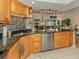 Eat-in kitchen featuring stainless steel appliances and ample cabinet space at 232 Woodland Dr, Osprey, FL 34229