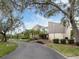 Building exterior showcasing landscaping and a paved driveway at 232 Woodland Dr, Osprey, FL 34229