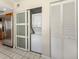 Convenient laundry closet with stackable washer and dryer at 232 Woodland Dr, Osprey, FL 34229