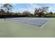 Two well-maintained tennis courts for recreational use at 232 Woodland Dr, Osprey, FL 34229
