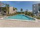 Community pool with lounge chairs and patio area at 232 Woodland Dr, Osprey, FL 34229