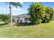 Landscaped backyard with a screened pool and lush greenery at 11332 Rivers Bluff Cir, Lakewood Ranch, FL 34202